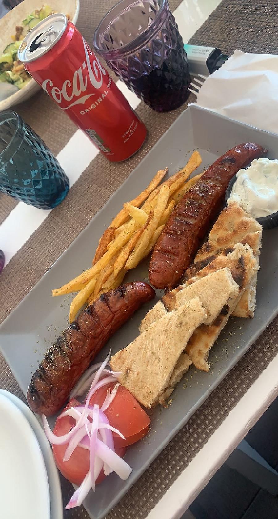 Grilled Santorini sausages with fries, pita, tomato and tzatziki